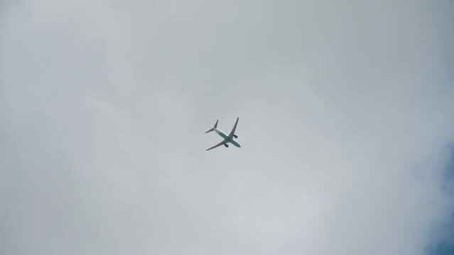 Passenger plane flying in the clouds