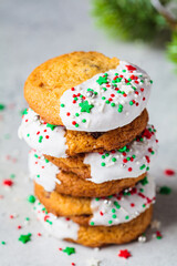 Stack of Christmas cookies glazed with holiday sprinkles.