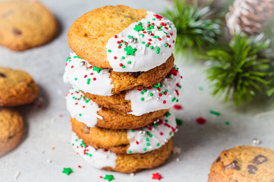 Stack of Christmas cookies glazed with holiday sprinkles.