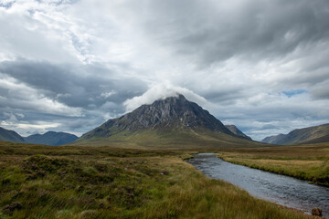 Naklejka na ściany i meble Scottish mountain with summit in cloud