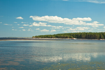 sea and island, in the photo sea water island horizon line and blue sky with clouds