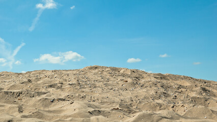 sand and blue sky, in the photo sand mountain blue sky and clouds