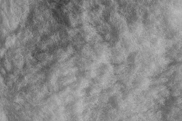 Naklejka premium gray background, woolen fabric close-up in the photo