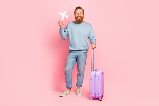 Full Size Portrait Of Positive Person Hand Hold Small Plane Figure Isolated On Pink Color Background