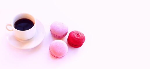 A cup of coffee and macaroons. Breakfast.
