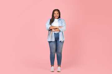 African Obese Woman Standing Crossing Hands Smiling On Pink Background