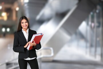 Happy saleswoman welcoming client standing in office.