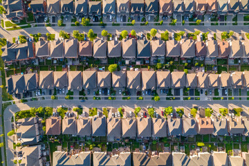 Aerial footage of Canadian town showing suburban housing estates in geometrical position and rows...