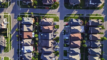 Aerial view of middle class residential houses at summer evening. American neighbourhood suburb....