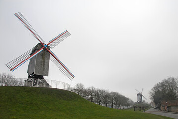 Brugge or Bruges, West Flanders, Belgium: Two windmills on Kruisvest, a park on the edge of the...