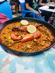 People eating Paella in a Valencian restaurant.