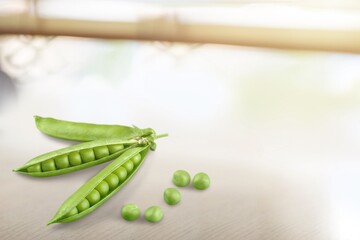 Perfect tasty green peas in pod on the desk