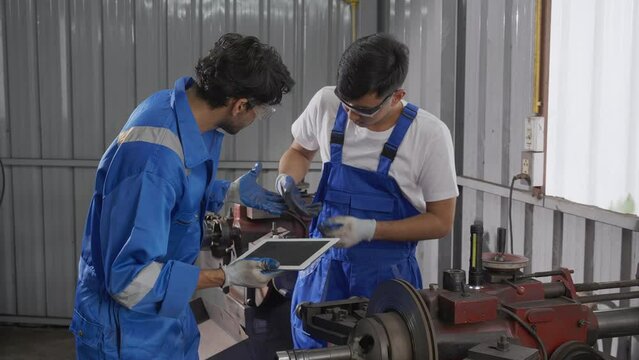 Supervisor training with young man sanding or iron at industrial factory, mechanic working job while polish metal, insurance and safety, accident and hurt, labor and steelworks, industry concept.