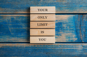 Your only limit is you sign written on a stack of five wooden pegs