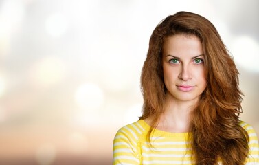 Naklejka premium Beautiful face of a woman with stylish hairstyle. Attractive girl with a makeup.