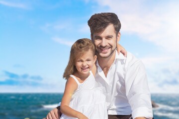 Shot of a man spending the day at the beach with his adorable child.