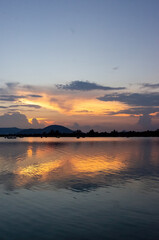 lake of chapala, jalisco mexico, lake at sunset with fishing boats, sun reflection on the lake, mexico