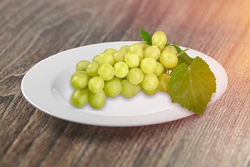 Tasty sweet aroma ripe grapes on a plate