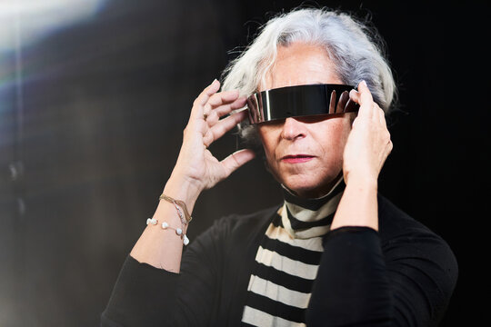 Elderly woman in futuristic sunglasses