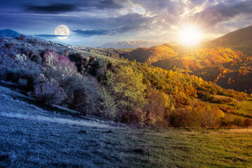 day and night time change in mountain landscape. beautiful conceptual autumn scenery with sun and moon. forest in fall foliage and grassy alpine meadows on the hills. clouds on the gorgeous sky