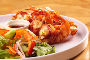Fried shrimp with bacon, sweet sauce, salad and rice, food, gastronomy
