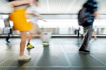 Fototapeta premium Tourist with suitcase walking on footbridge