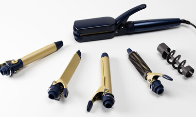 A set of hairdresser's tools for styling hair on a white background