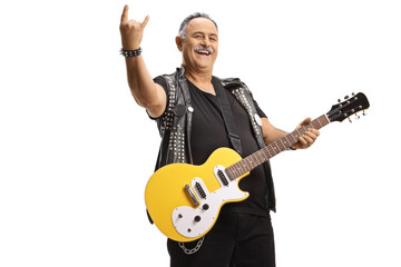 Mature rock guitarist with an electric guitar gesturing a rock and roll sign