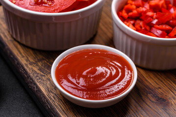 Ingredients for making shakshuka, dishes with fried eggs with tomato sauce, spices and herbs