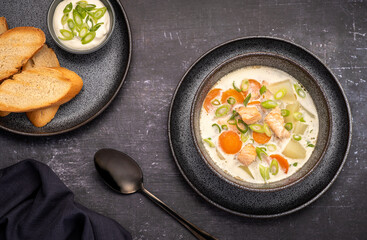 Food photography of salmon soup, potato, carrot, cream, onion, toast