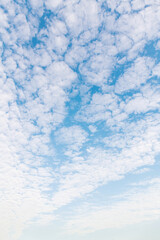 The blue sky covered with white clouds