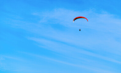 paragliding in the blue sky