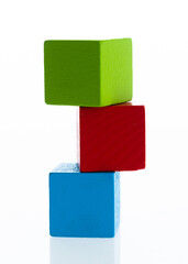 Fototapeta premium Three wooden blocks on white background