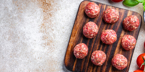 raw meat balls ground meat ground fresh pork, beef, lamb cooking healthy meal food snack diet on the table copy space food background rustic top view
