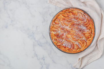 Apple pie. Homemade pie of fresh apples with custard and cinnamon. Delicious autumn pastries....