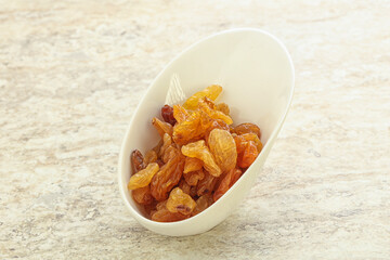 Sweet yellow raisin in the bowl