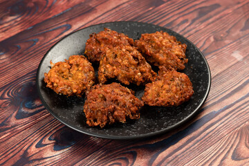 Indian spicy vegetable pakora or pakoda served in dish isolated on table top view