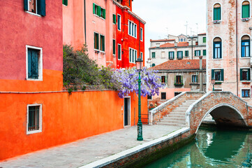 Old colorful architecture on the canal with bridge in Venice, Italy. . Beautiful european cityscape.