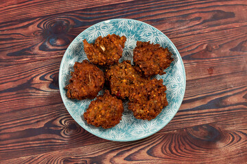 Indian spicy vegetable pakora or pakoda served in dish isolated on table top view