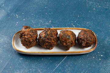 Indian spicy vegetable pakora or pakoda served in dish isolated on table top view