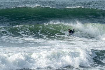 Bodyboarder riding a wave in Furadouro beach, Ovar,  Aveiro - Portugal.