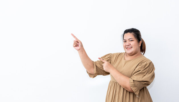 Portrait images of Asian fat woman She is smiling brightly, Show inviting gestures of advertisements, On white background, to people and advertising concept.