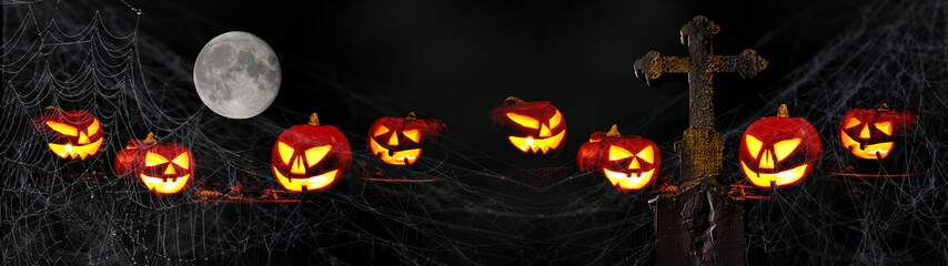 Scary Halloween celebration holiday card background banner panorama - Spooky carved pumpkins,...