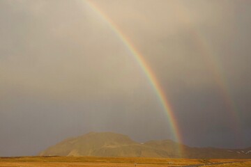 Fototapeta na wymiar Double rainbow above the mountains