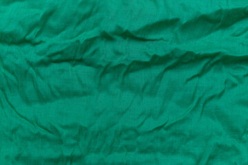 Crumpled green fabric background