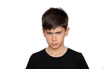 Childhood, emotional, anger, hate and people concept - Angry boy in black t shirt. Isolated on the...