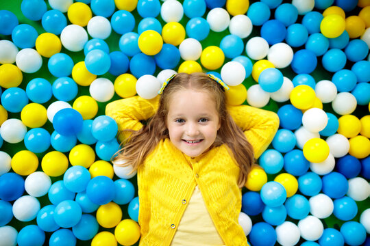 Kids Play In Ball Pit. Child Playing In Balls Pool