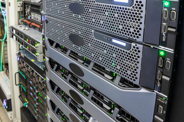 The front panel of powerful servers is in the data center. Computers with many hard drives are in the rack.