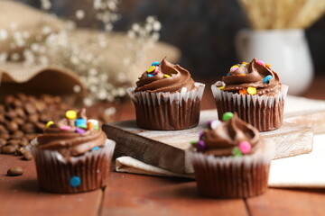 fresh baked chocolate muffins with whipped cream
