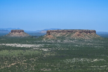 Namibia, panorama of the Namib desert, wild landscape with a dirt road in background
